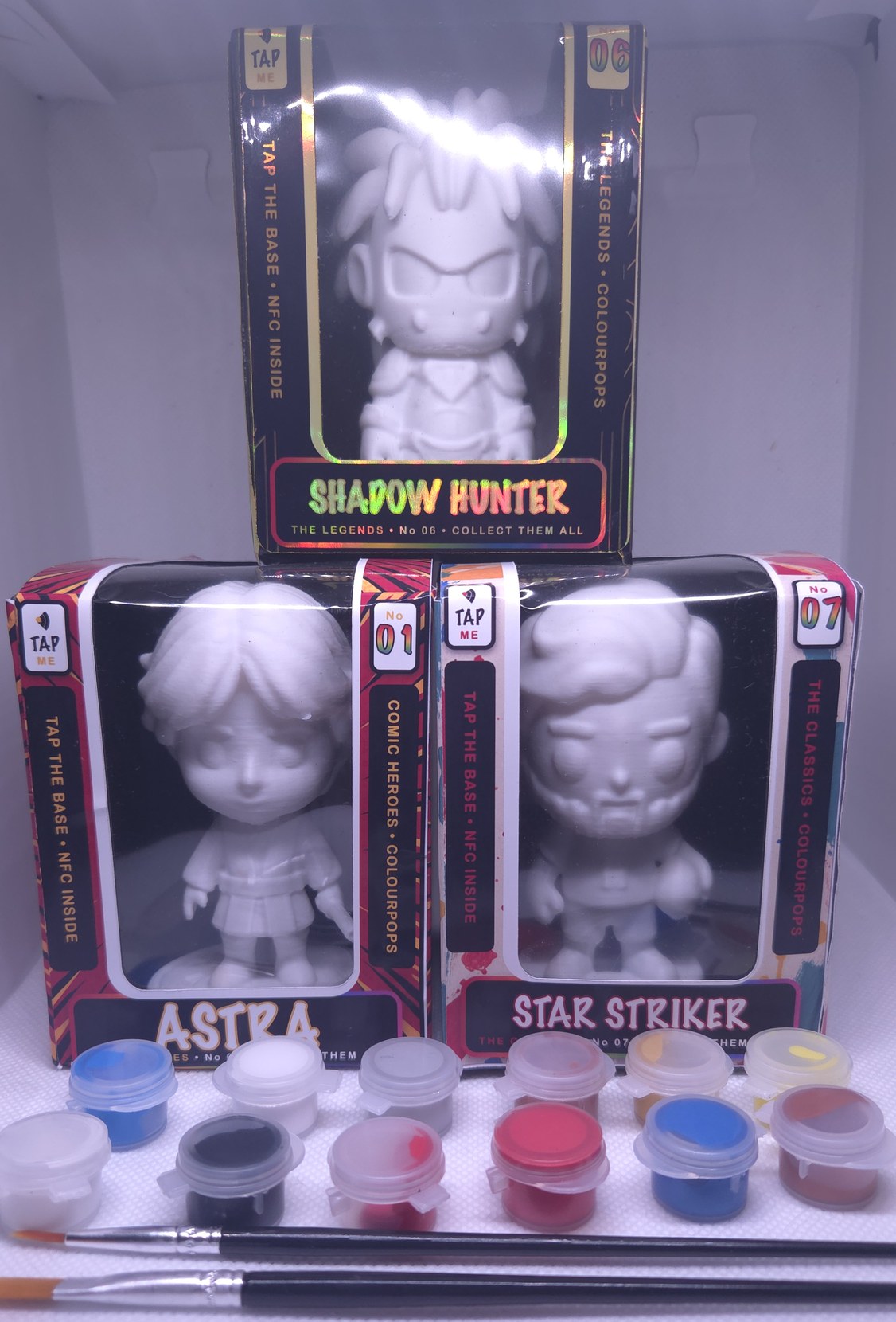 Three boxed ColourPops with twelve paint pots and two brushes